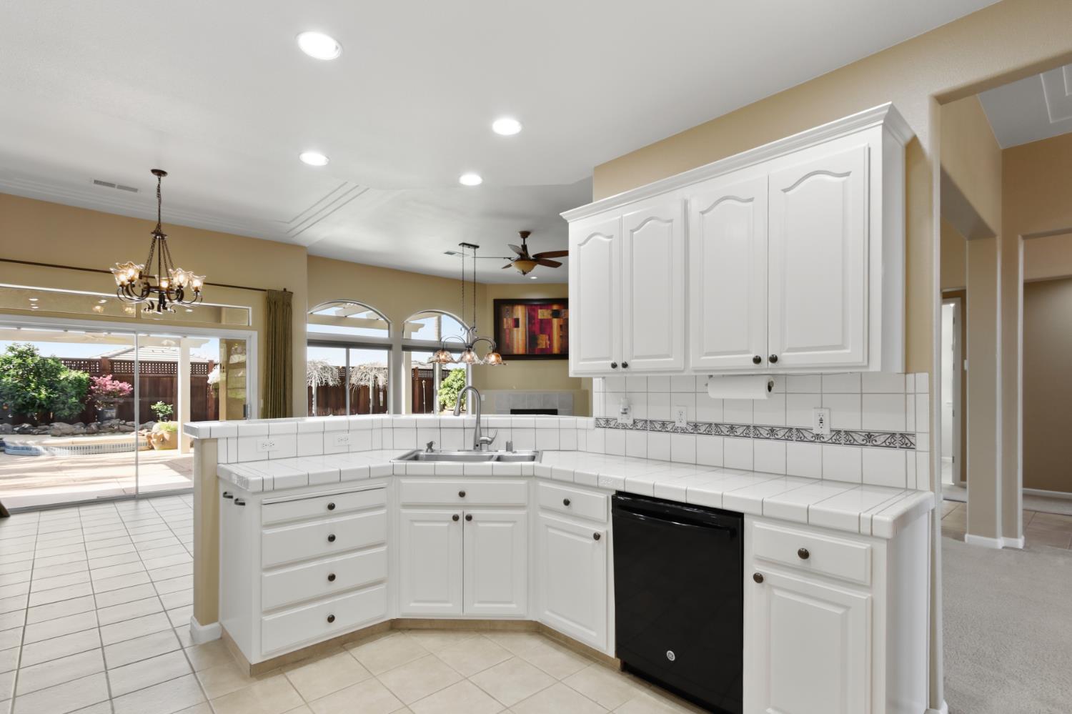702 Shakeley Lane Ione, CA 95640 - Photo 31 of 71 a kitchen with a sink stove and cabinets