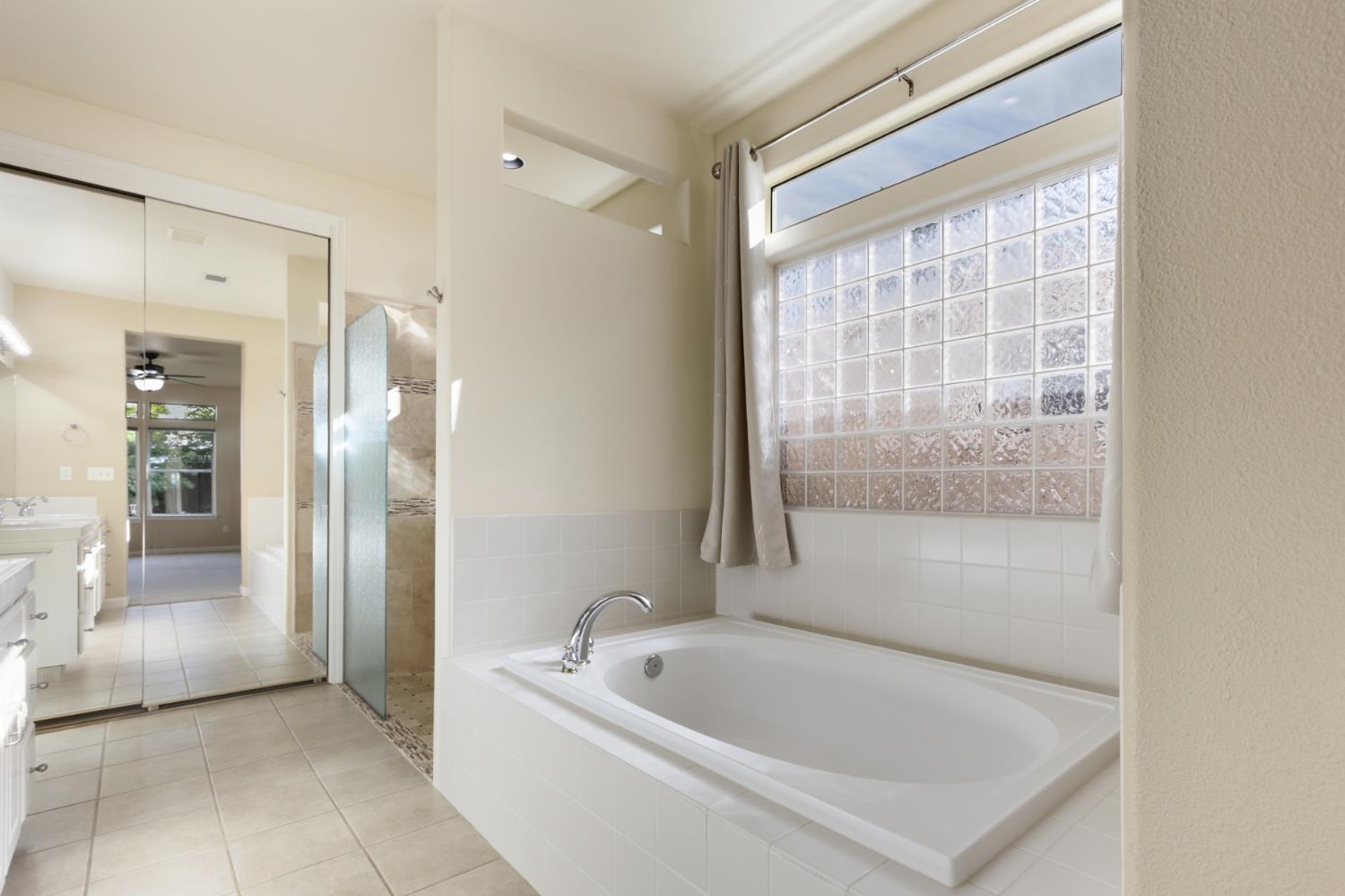 702 Shakeley Lane Ione, CA 95640 - Photo 43 of 71 a bathroom with a bathtub and a shower