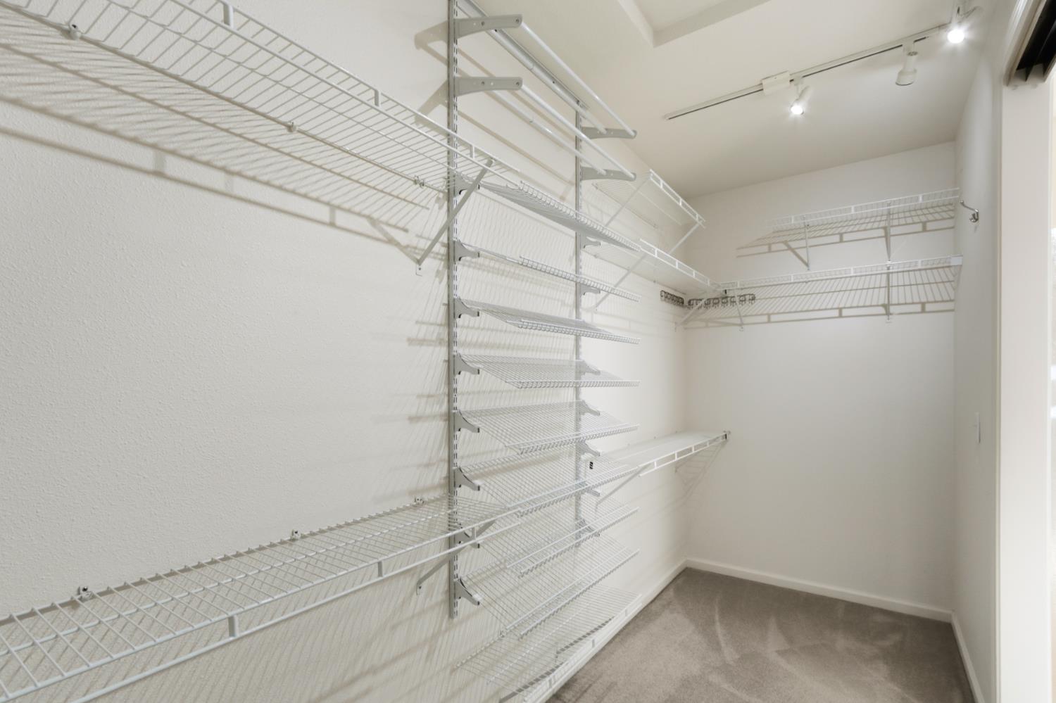 702 Shakeley Lane Ione, CA 95640 - Photo 44 of 71 a view of walk in closet with empty racks