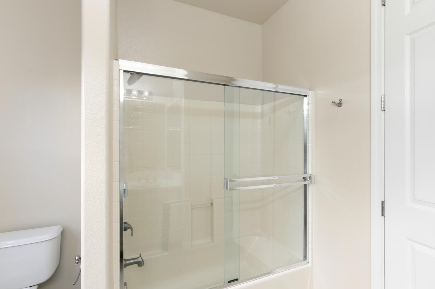 702 Shakeley Lane Ione, CA 95640 - Photo 49 of 71 a bathroom with a glass shower door