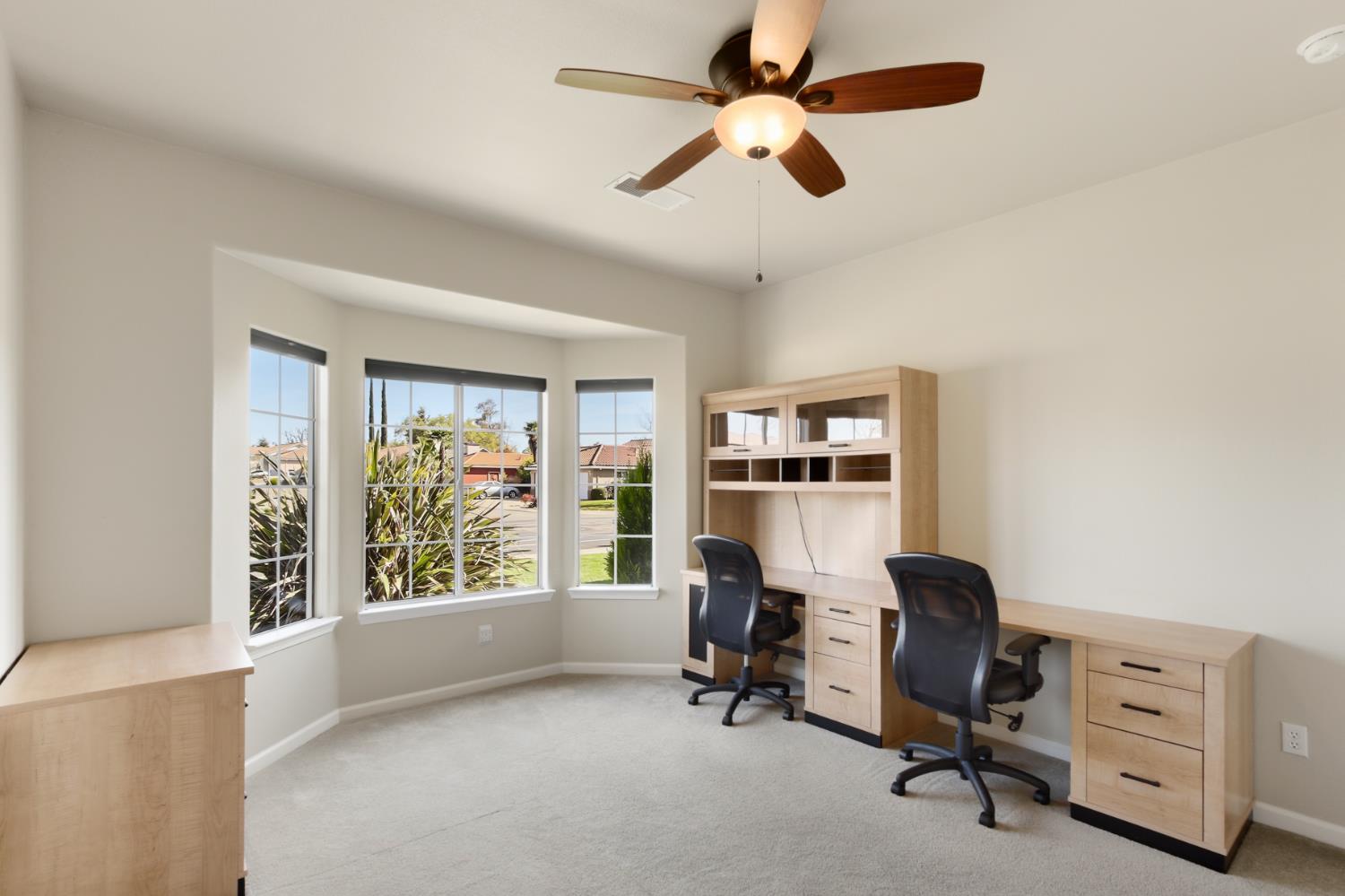 702 Shakeley Lane Ione, CA 95640 - Photo 50 of 71 a view of a workspace with furniture and a window