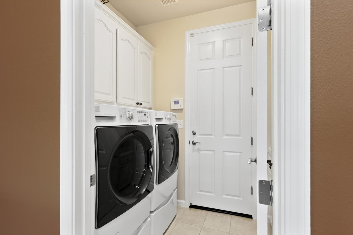 702 Shakeley Lane Ione, CA 95640 - Photo 52 of 71 a view of a storage and utility room with washer and dryer