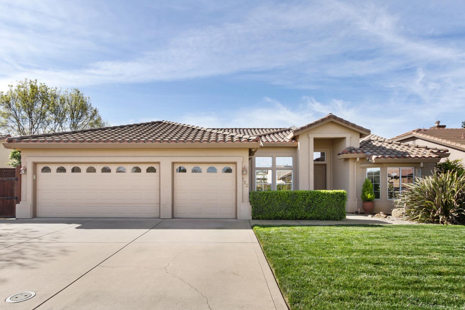 702 Shakeley Lane Ione, CA 95640 - Photo 71 of 71 a front view of a house with a yard and garage