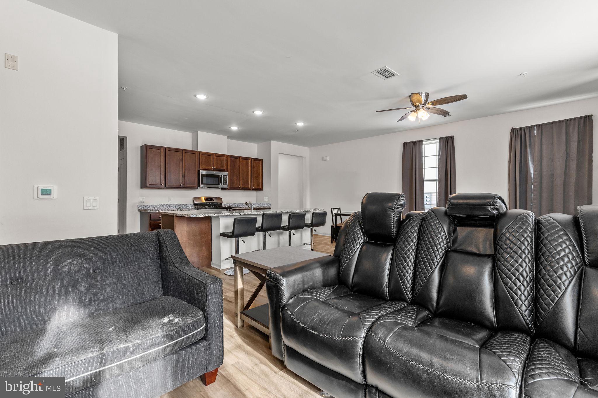 228 Park Lane Dunellen, NJ 08812 - Photo 13 of 35 a living room with furniture and a view of kitchen