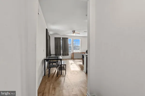 a view of a livingroom with furniture and hardwood floor