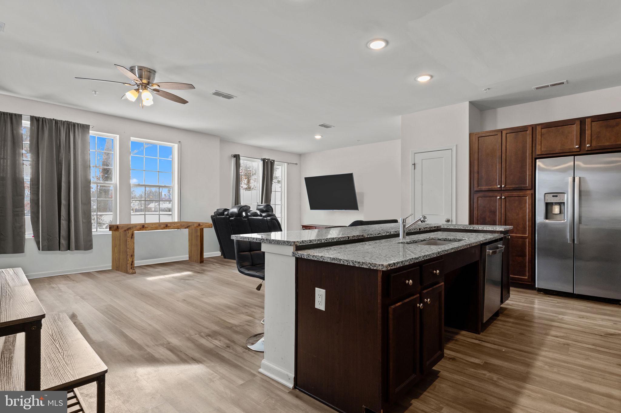 228 Park Lane Dunellen, NJ 08812 - Photo 5 of 35 a kitchen with stainless steel appliances granite countertop a stove and a refrigerator