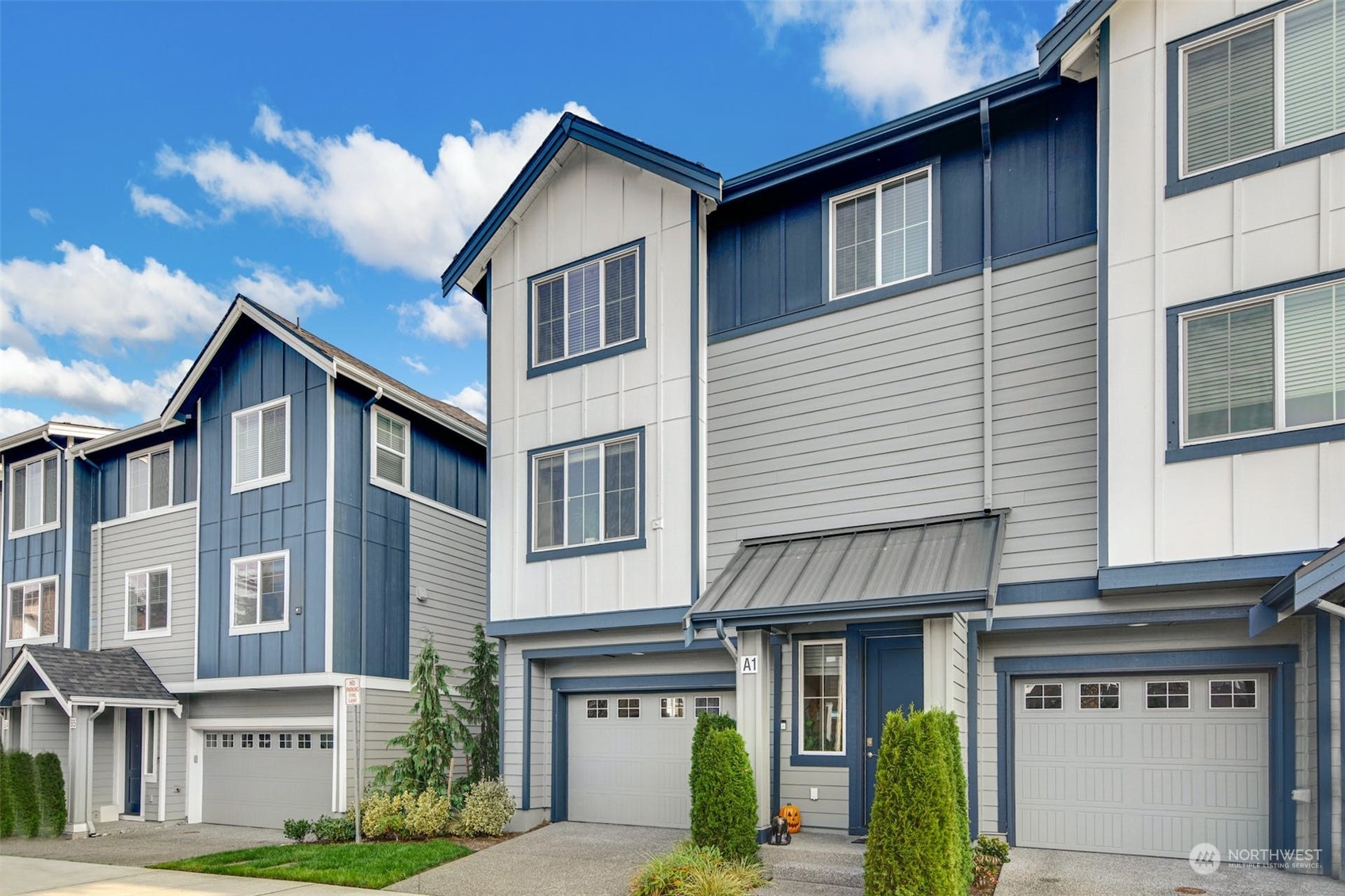 1621 Seattle Hill Road, Unit A1 Bothell, WA 98012 - Photo 27 of 28 a front view of a residential apartment building with a yard
