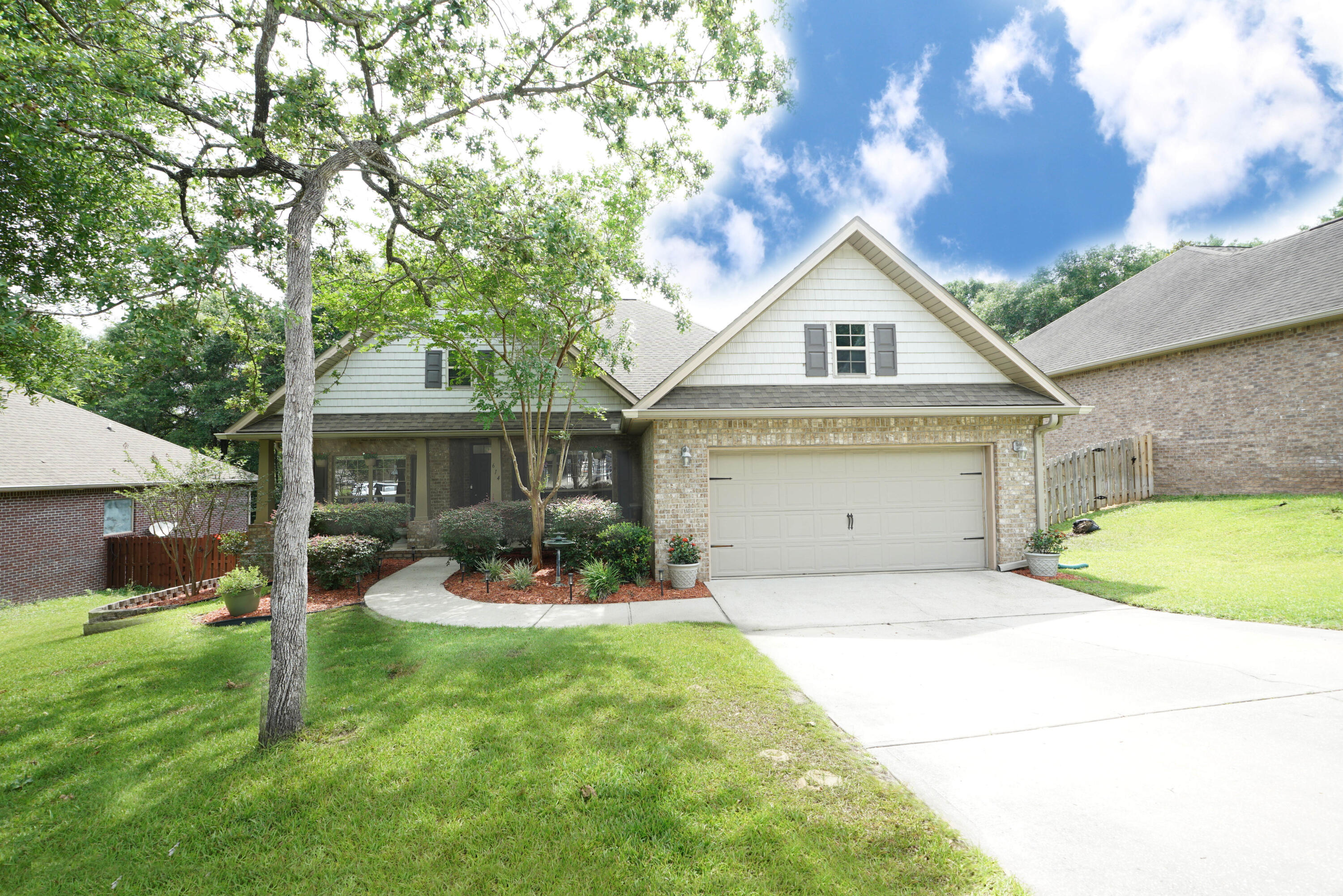 614 Red Fern Road Crestview, FL 32536 - Photo 1 of 43 a front view of a house with a yard and garage