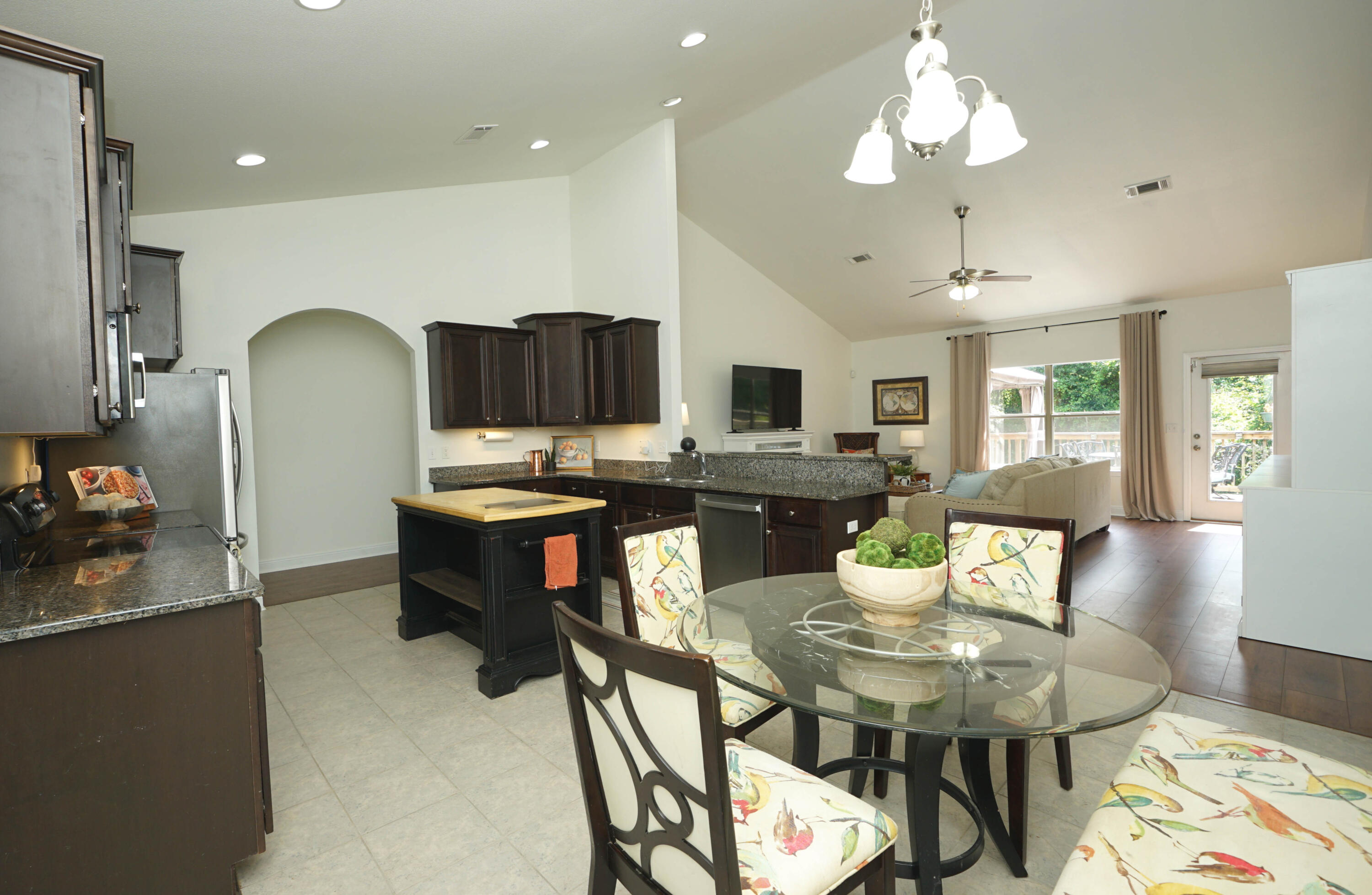 614 Red Fern Road Crestview, FL 32536 - Photo 13 of 43 a view of a dining room with furniture and wooden floor