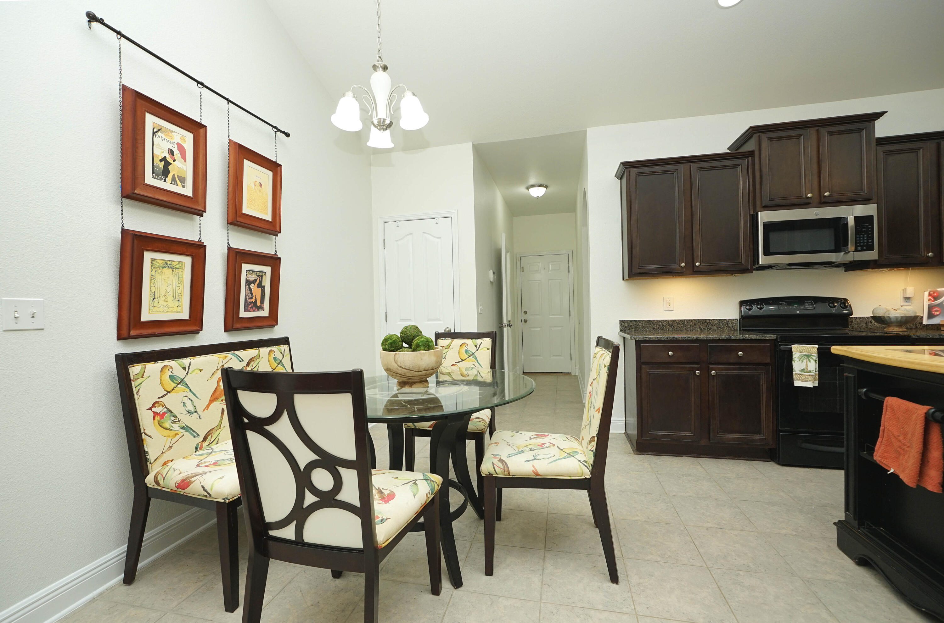 614 Red Fern Road Crestview, FL 32536 - Photo 16 of 43 a kitchen with a dining table and chairs