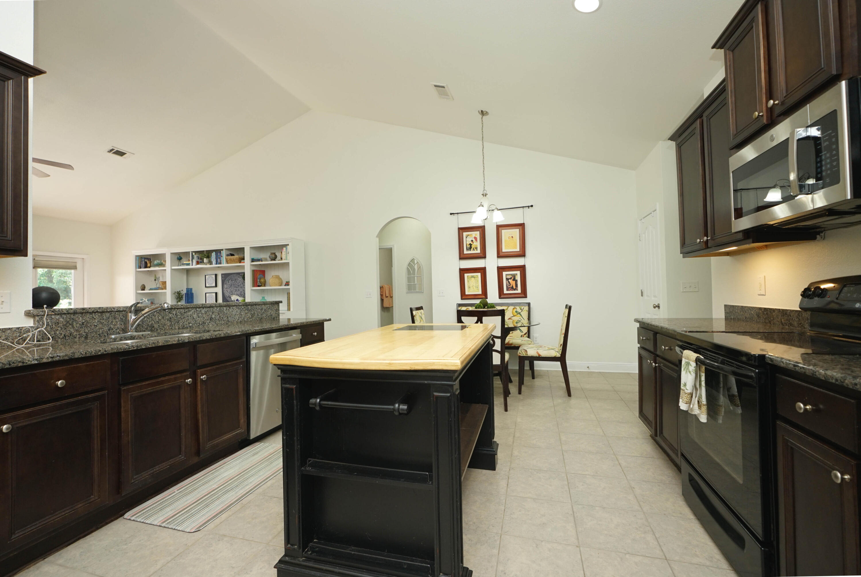 614 Red Fern Road Crestview, FL 32536 - Photo 17 of 43 a kitchen with stainless steel appliances granite countertop a sink and stove
