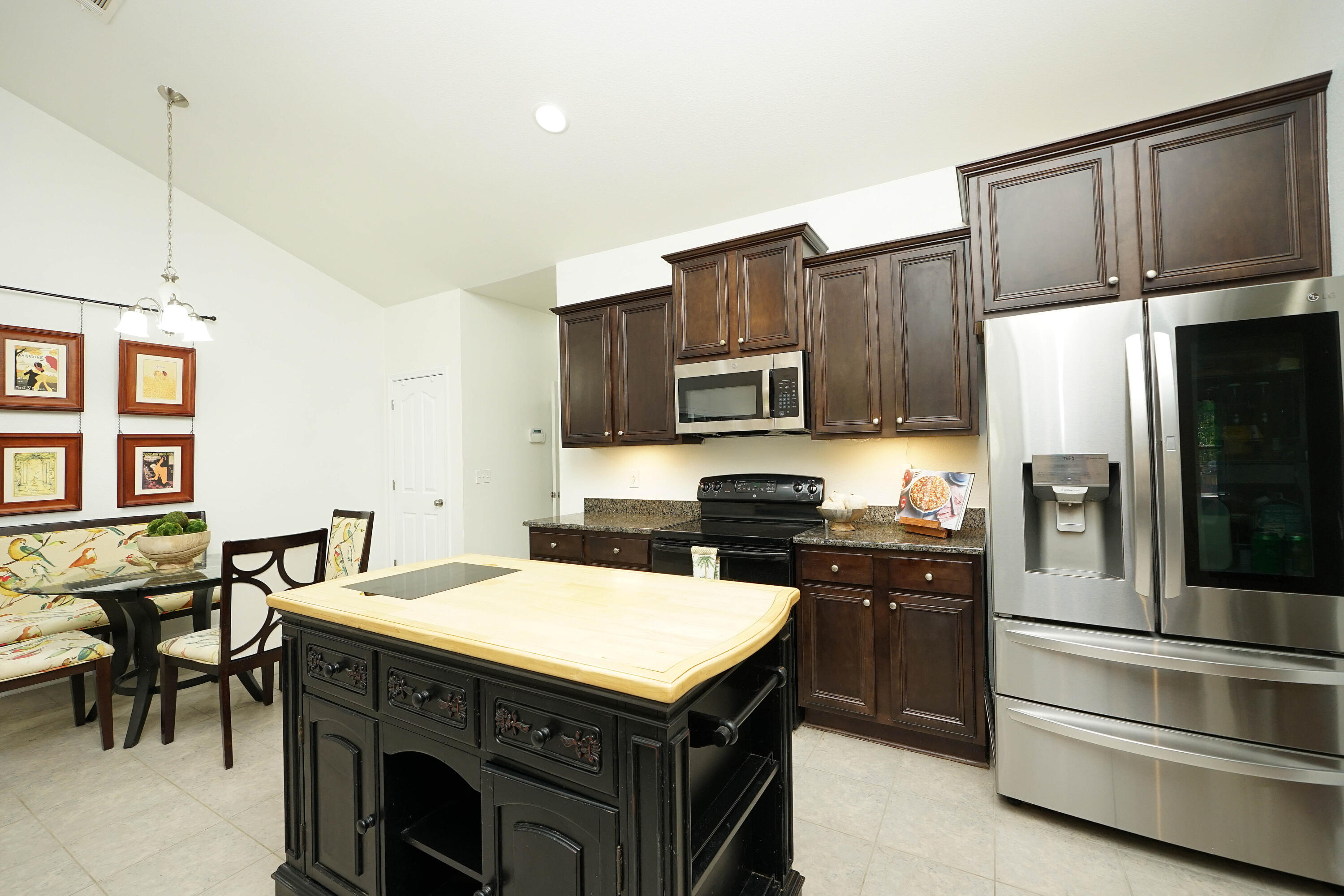 614 Red Fern Road Crestview, FL 32536 - Photo 18 of 43 a kitchen that has a stove a microwave and a refrigerator