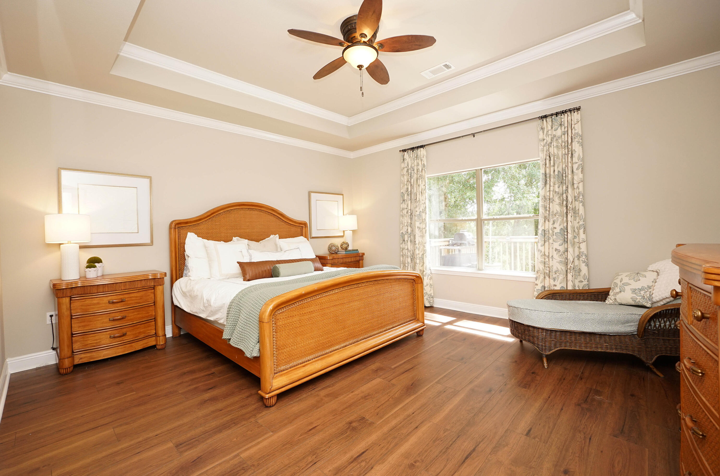 614 Red Fern Road Crestview, FL 32536 - Photo 21 of 43 a bedroom with a bed and a chandelier