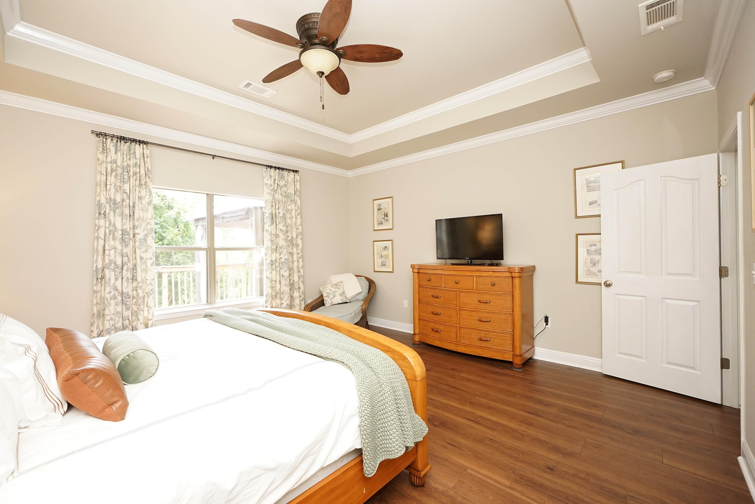 614 Red Fern Road Crestview, FL 32536 - Photo 22 of 43 a bedroom with a bed and flat screen tv