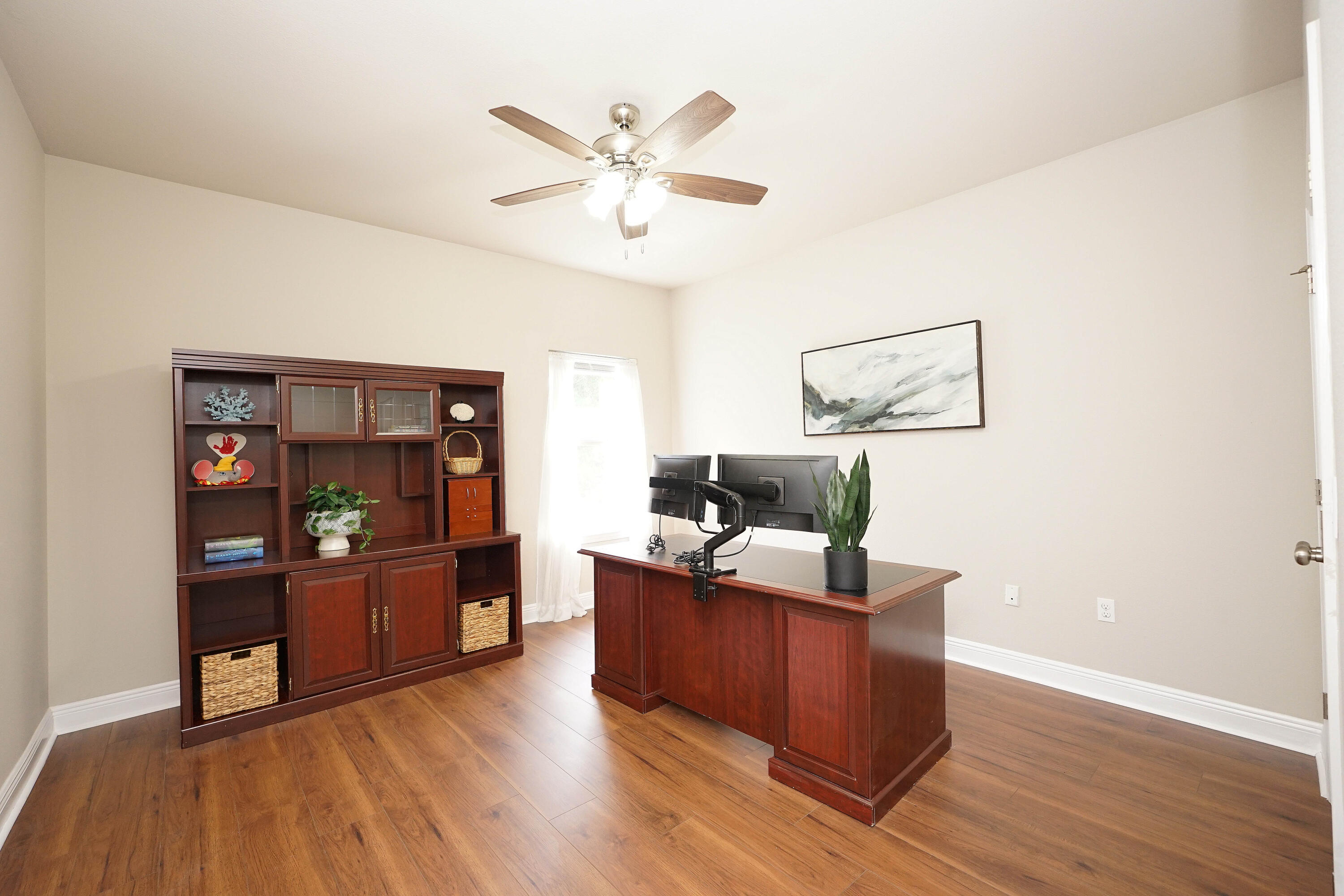 614 Red Fern Road Crestview, FL 32536 - Photo 29 of 43 a living room with furniture and a wooden floor