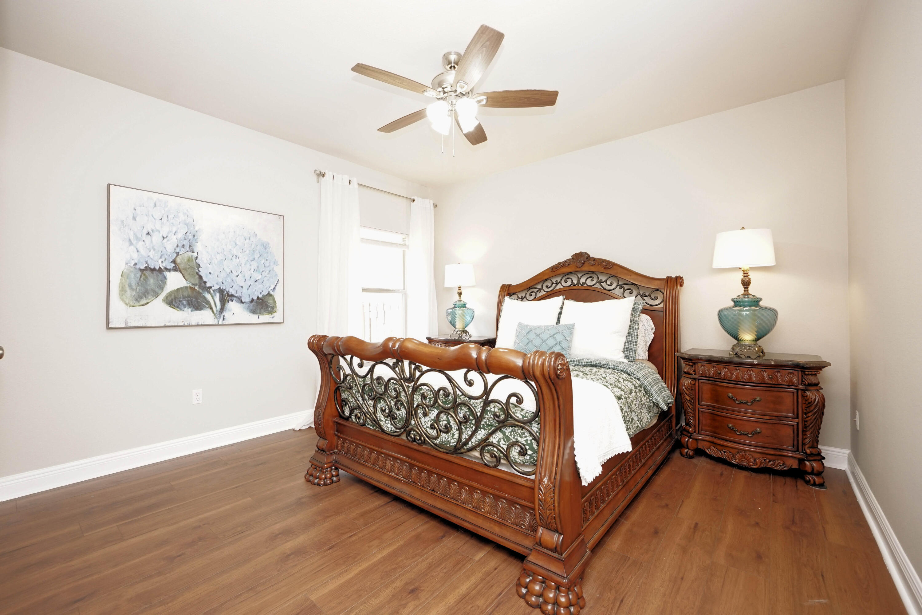 614 Red Fern Road Crestview, FL 32536 - Photo 30 of 43 a bedroom with bed and wooden floor