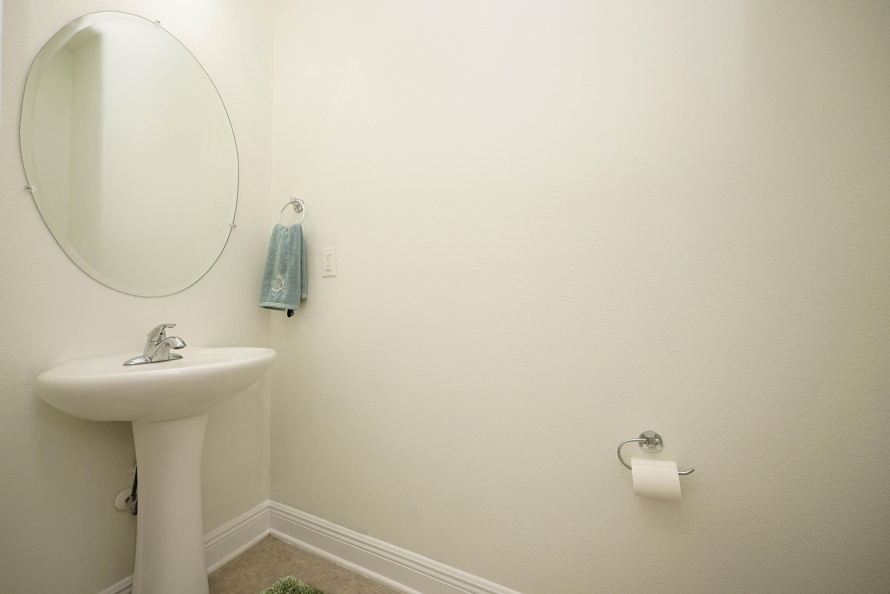 614 Red Fern Road Crestview, FL 32536 - Photo 35 of 43 a bathroom with a sink and mirror