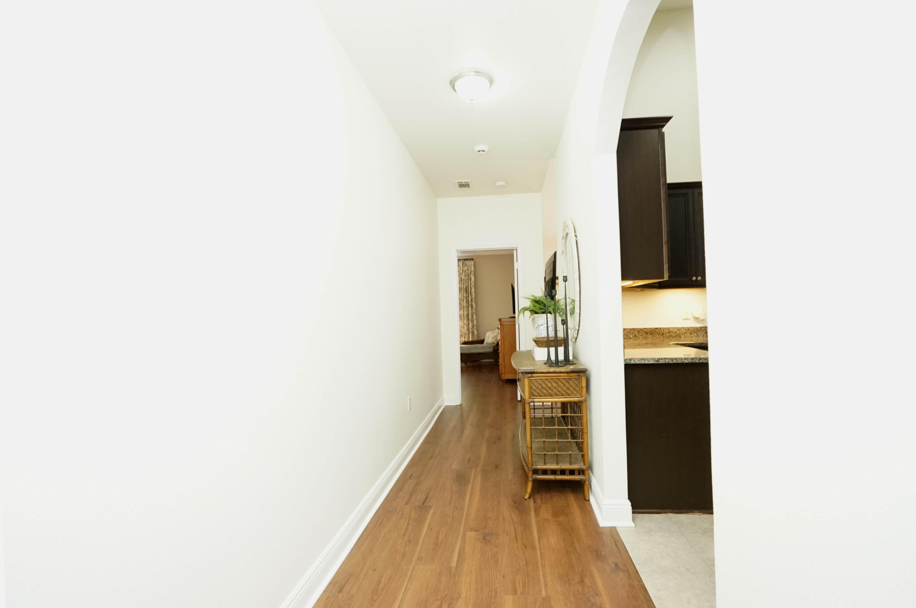 614 Red Fern Road Crestview, FL 32536 - Photo 6 of 43 a view of a hallway with wooden floor
