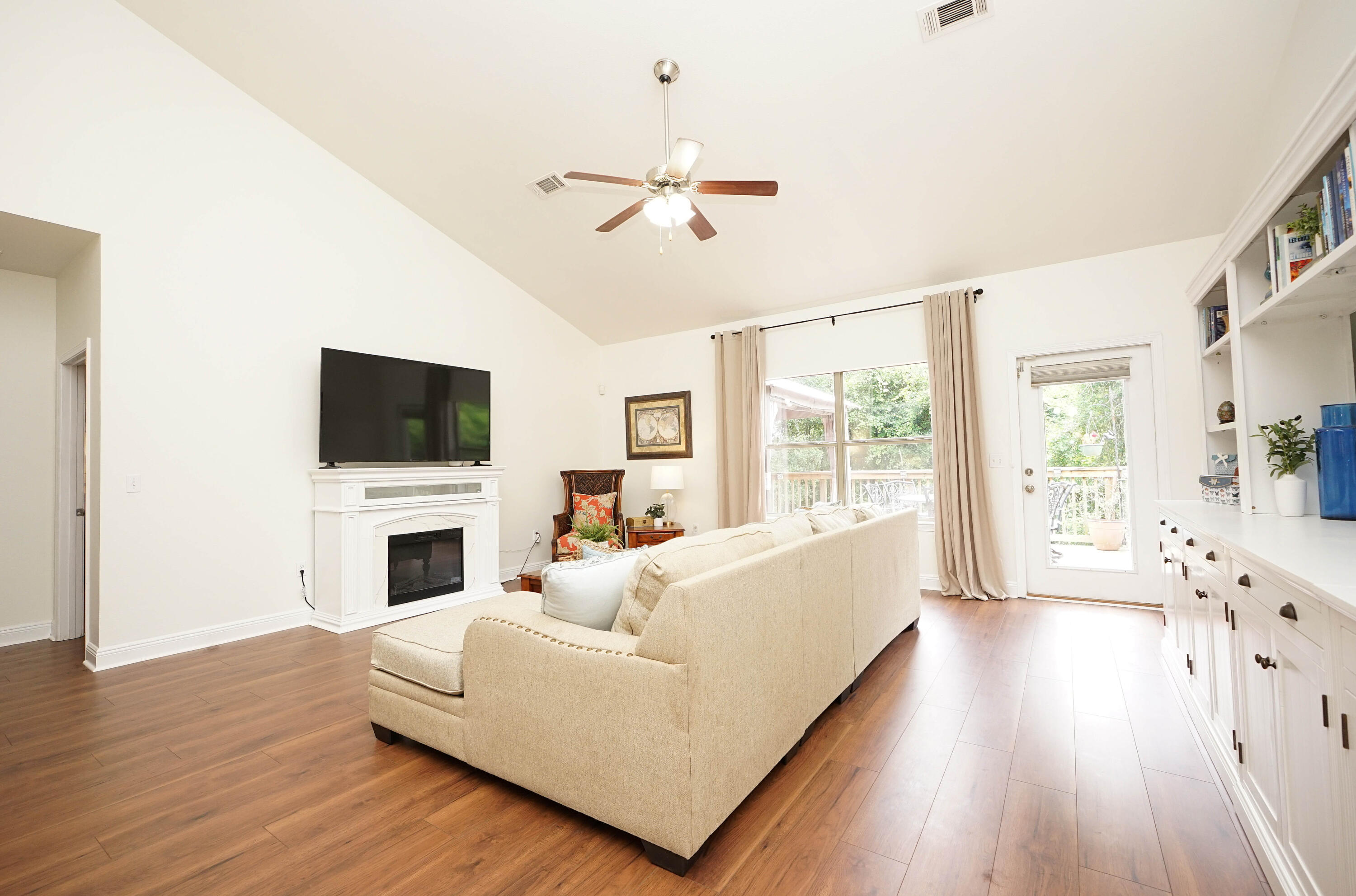 614 Red Fern Road Crestview, FL 32536 - Photo 8 of 43 a living room with furniture fireplace and flat screen tv