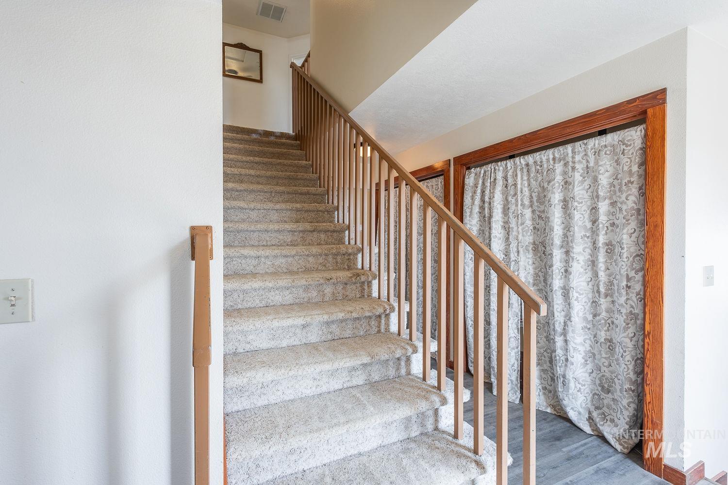 6050 Elmore Road Fruitland, ID 83619 - Photo 15 of 48 Stairway with wood finished floors