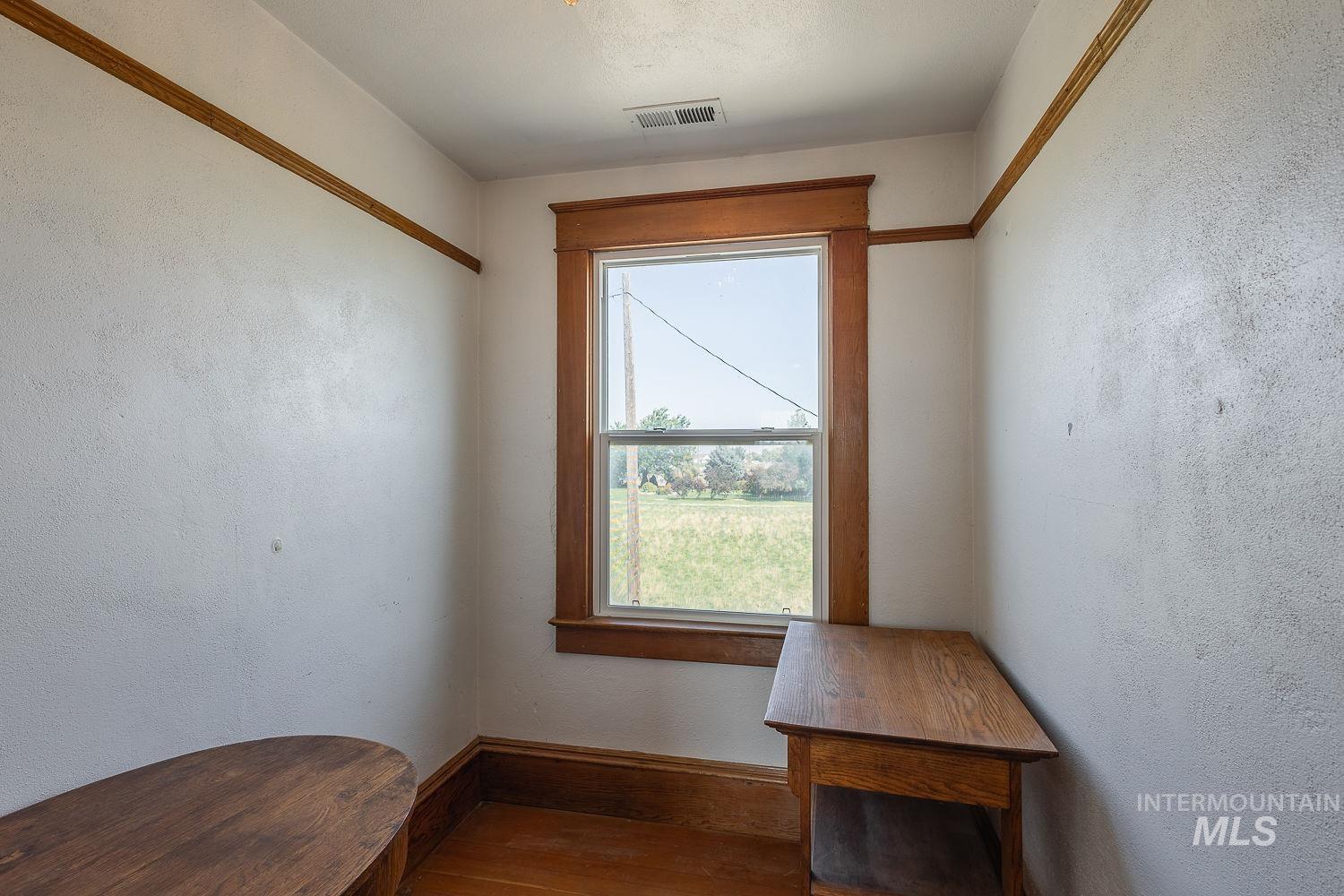 6050 Elmore Road Fruitland, ID 83619 - Photo 25 of 48 Unfurnished office with a textured wall and wood finished floors