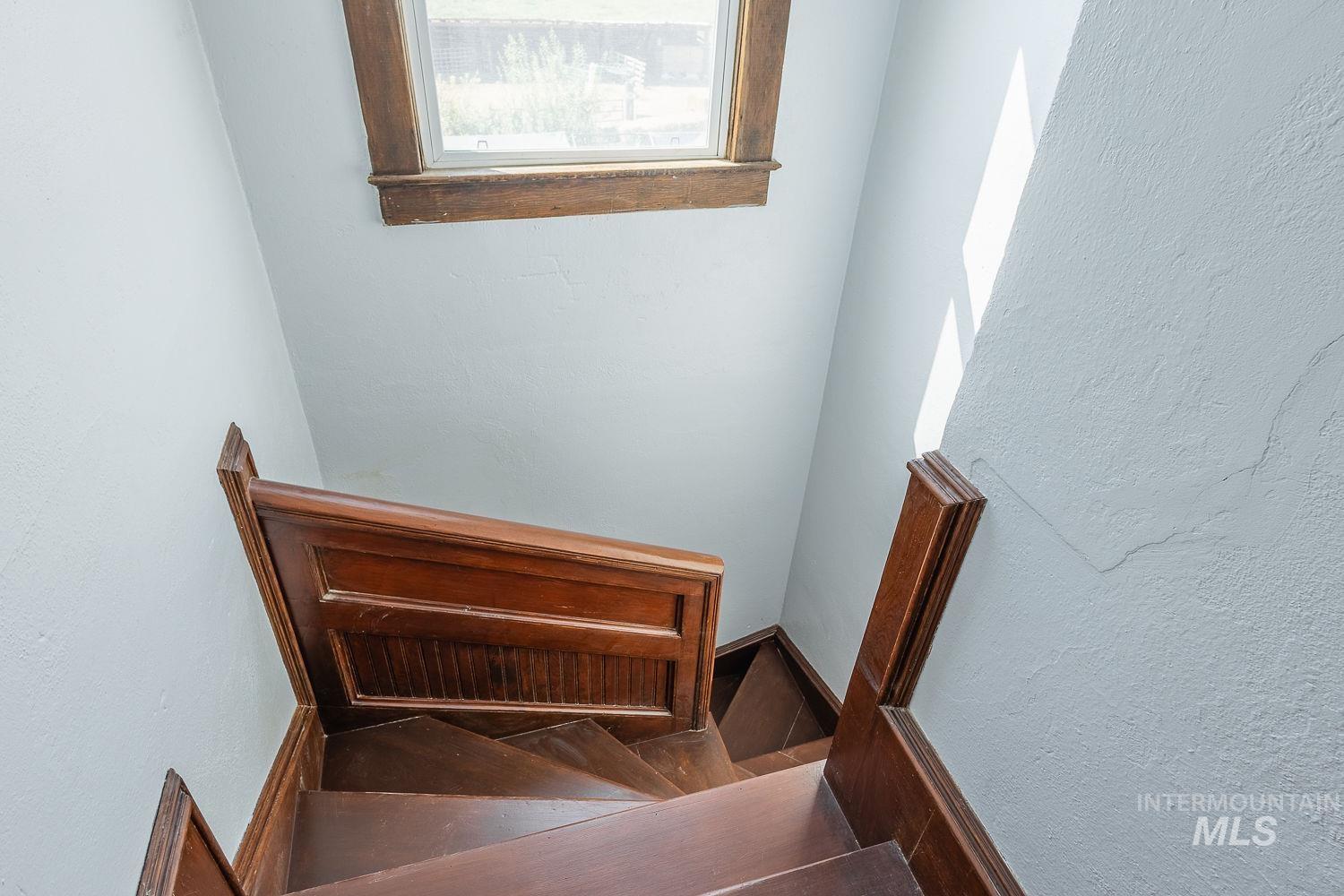6050 Elmore Road Fruitland, ID 83619 - Photo 26 of 48 Staircase featuring a textured wall