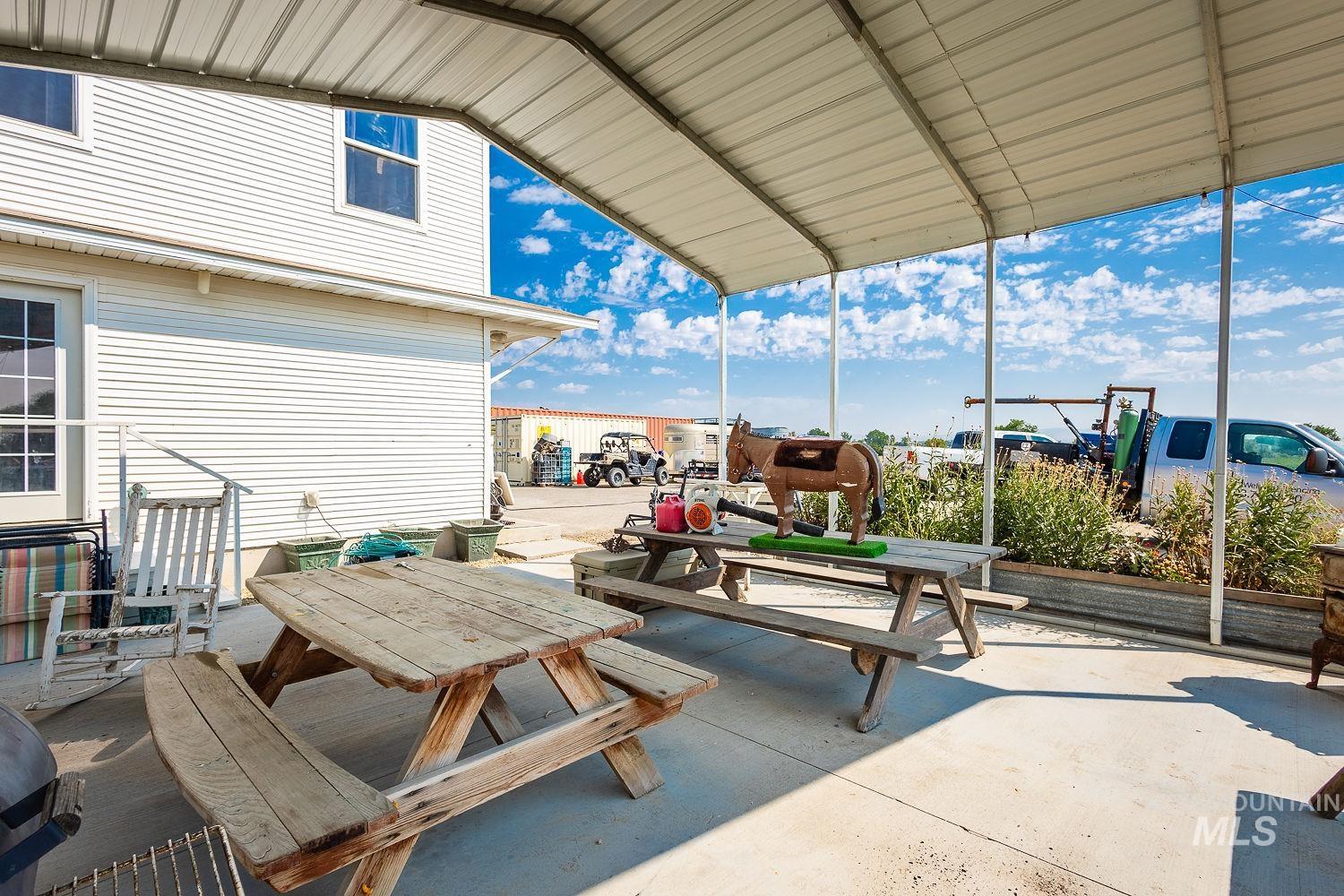 6050 Elmore Road Fruitland, ID 83619 - Photo 37 of 48 View of patio featuring outdoor dining space