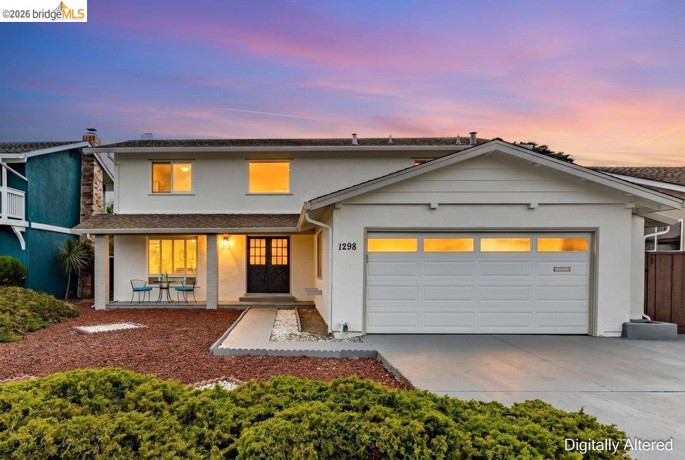 1298 Ribbon Street Foster City, CA 94404 - Photo 2 of 86 Two-story residence featuring a white stucco exterior and an attached garage with translucent paneling