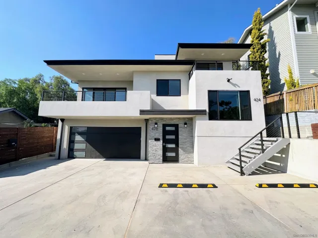 a view of a white building with many windows