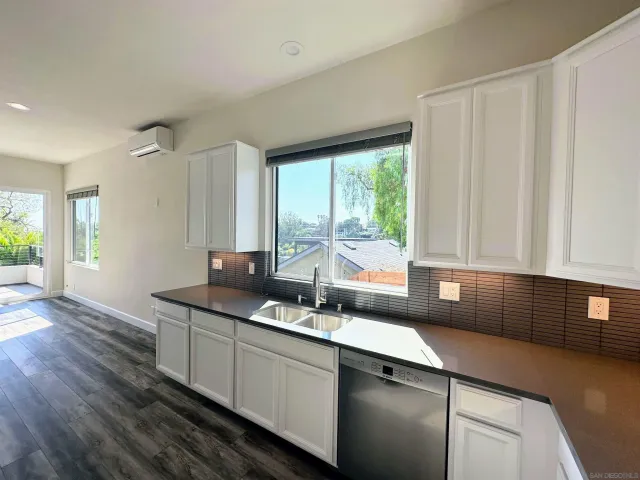 a kitchen with a sink and a window