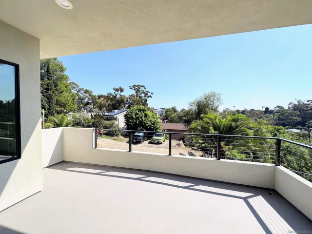 a view of balcony with two chairs and a table