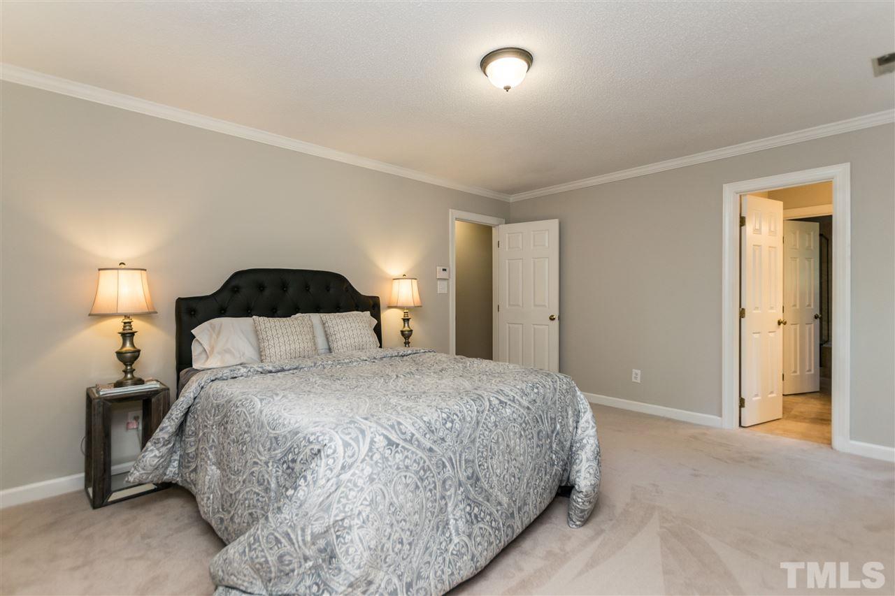 4908 Fielding Drive Raleigh, NC 27606 - Photo 13 of 25 This master suite is perfection. It has a large size room, a huge walk in closet, and a beautiful master bathroom with separate garden tub and shower. The entire upstairs has brand new carpet!