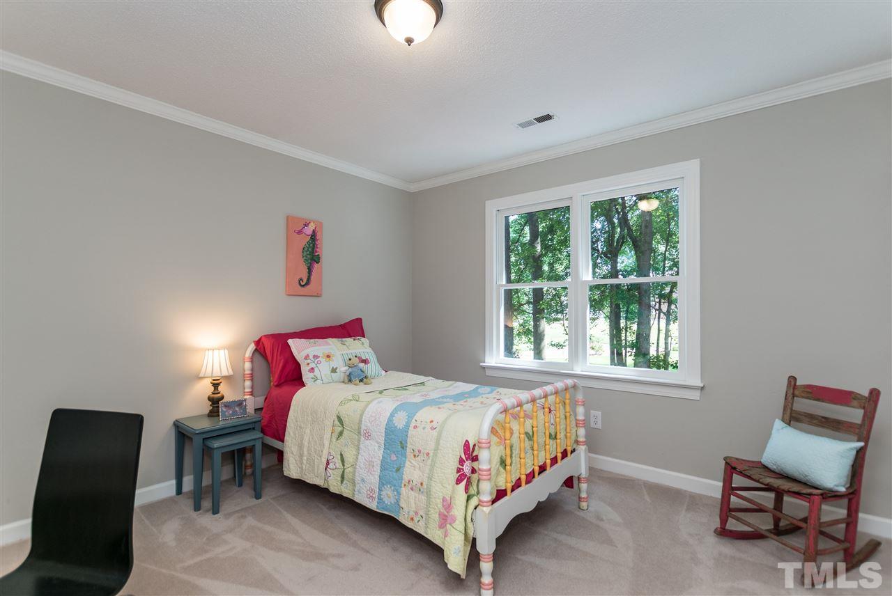 4908 Fielding Drive Raleigh, NC 27606 - Photo 18 of 25 This sweet bedroom has a double window that looks out onto the backyard. It has a nice size double door closet.