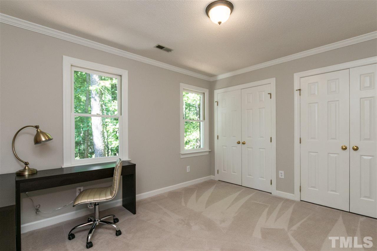 4908 Fielding Drive Raleigh, NC 27606 - Photo 19 of 25 This fourth bedroom is currently set up as an office. It has windows looking out on to the front yard, but the best part of this room are the closets! There are two double door closets in this room. Perfect for a little fashionista!