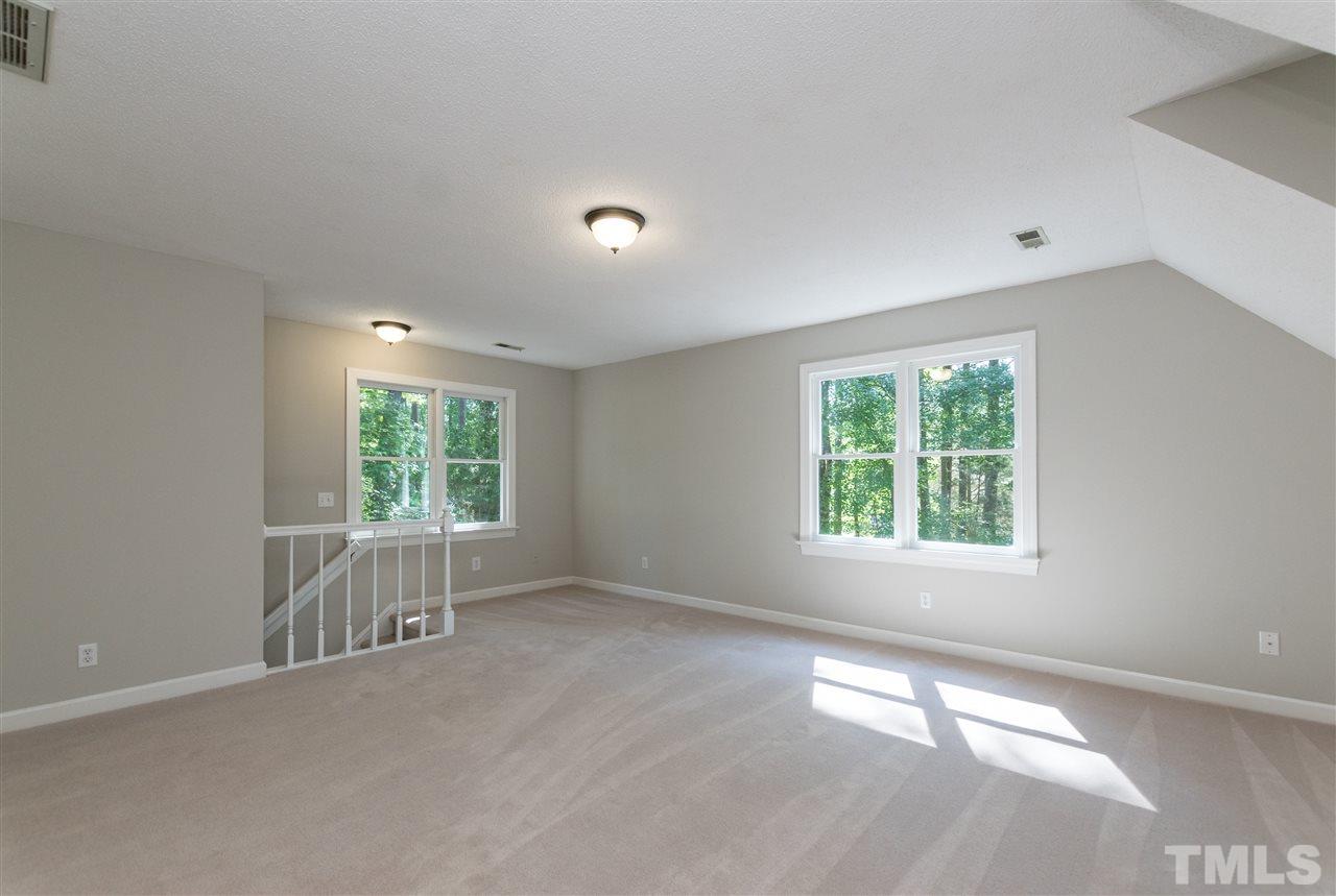 4908 Fielding Drive Raleigh, NC 27606 - Photo 21 of 25 This bonus room is huge! It would make an excellent playroom, a wonderful man cave, or use it as a fifth bedroom. There are backstairs that go to a hallway that accesses the backyard, garage, or kitchen.