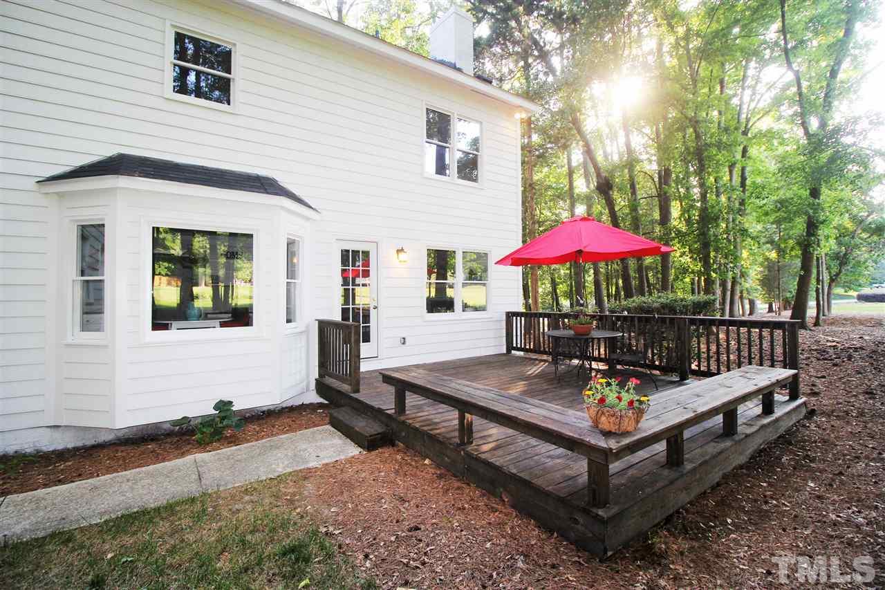 4908 Fielding Drive Raleigh, NC 27606 - Photo 23 of 25 There is a big deck off the family room. It is the perfect spot for entertaining! It is surrounded by built-in benches.