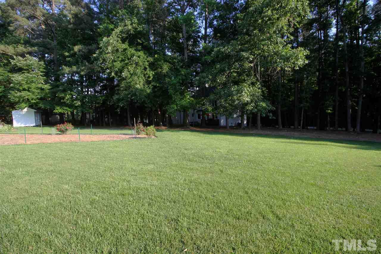 4908 Fielding Drive Raleigh, NC 27606 - Photo 24 of 25 The backyard is huge and you really get the best of both worlds. Close to the home is the peaceful, wooded section of yard and beyond that is a very large open grassy area. There is also a section for a garden too.