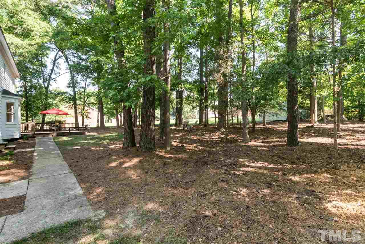 4908 Fielding Drive Raleigh, NC 27606 - Photo 25 of 25 There is a pathway that leads from driveway to the back yard. There is also a storage shed, not pictured.