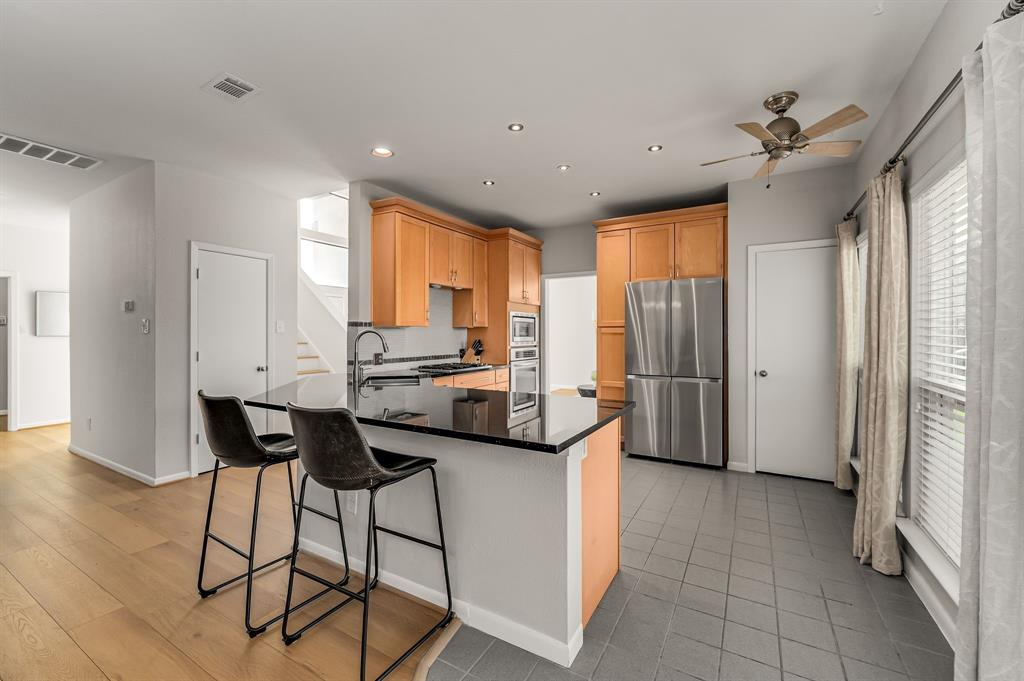 6053 Buffridge Trail Dallas, TX 75252 - Photo 12 of 40 a view of a kitchen with furniture and a window