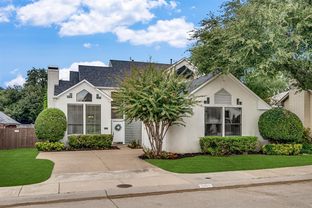 6053 Buffridge Trail Dallas, TX 75252 - Photo 2 of 40 a front view of a house with garden