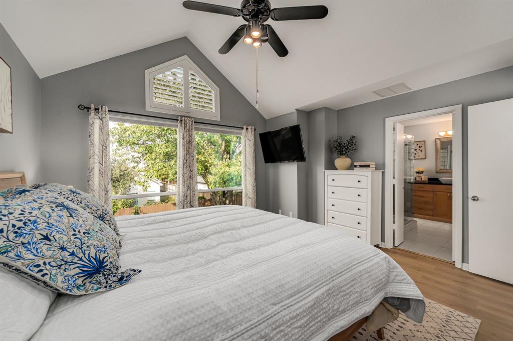 6053 Buffridge Trail Dallas, TX 75252 - Photo 21 of 40 a bedroom with a bed and a dresser