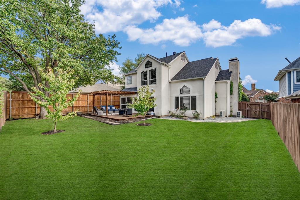 6053 Buffridge Trail Dallas, TX 75252 - Photo 30 of 40 a front view of a house with garden