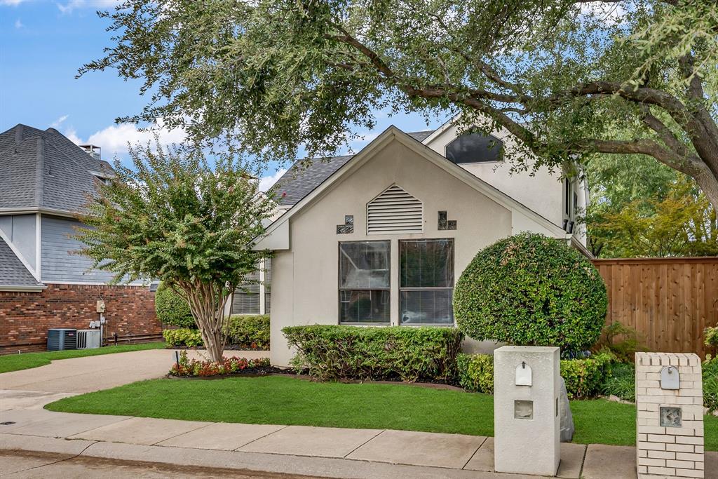 6053 Buffridge Trail Dallas, TX 75252 - Photo 3 of 40 a front view of a house with garden