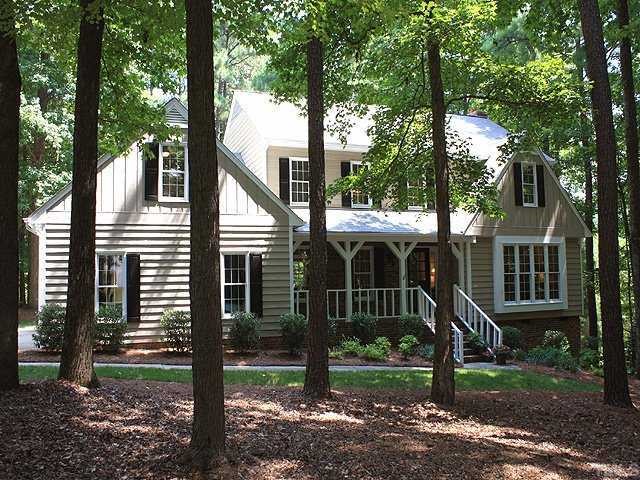 10220 Bushveld Lane Raleigh, NC 27613 - Photo 1 of 12 a view of a house with a yard and large tree