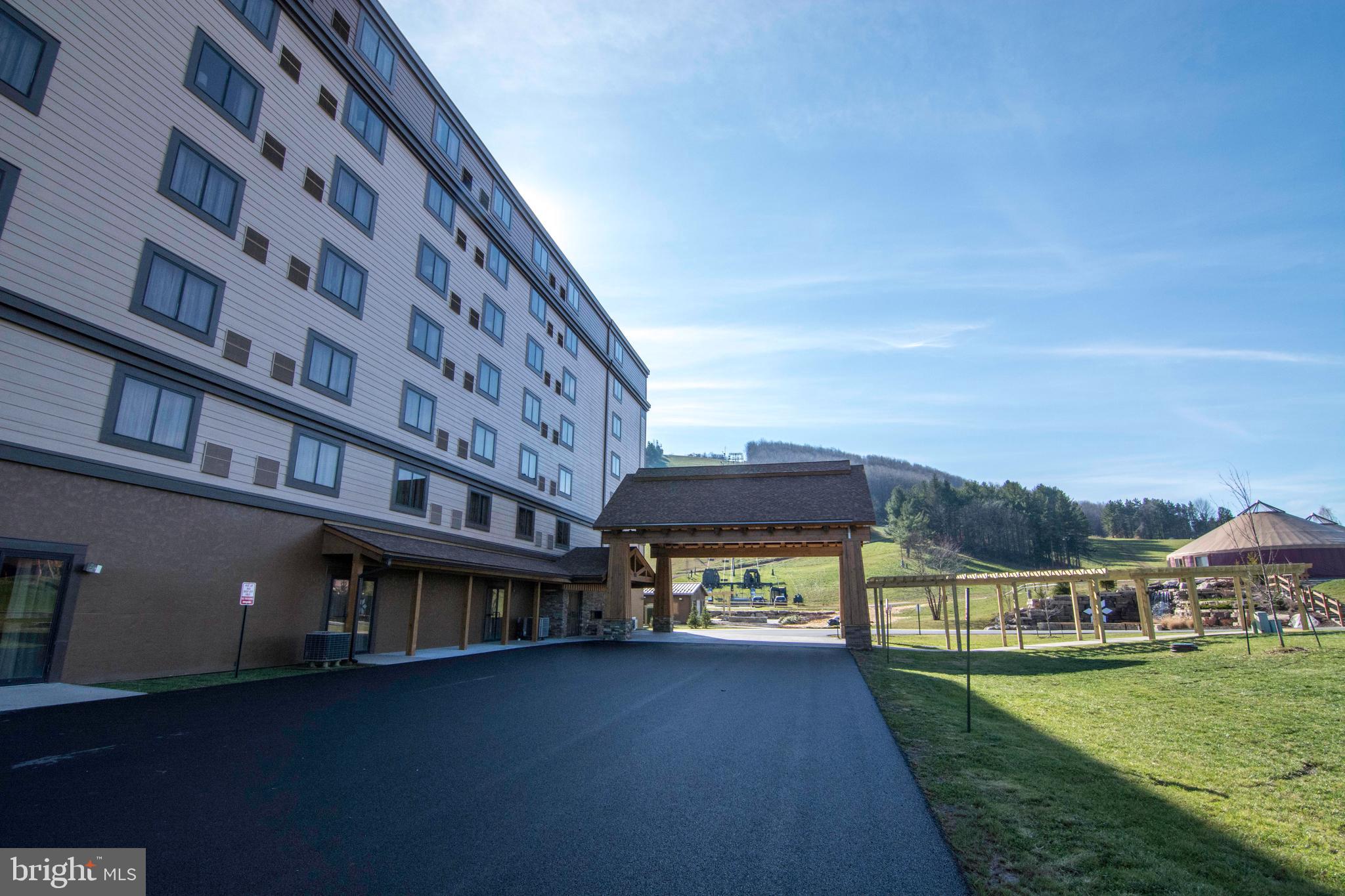 290 Marsh Hill Road, Unit 404G McHenry, MD 21541 - Photo 49 of 63 front view of a building with a big yard