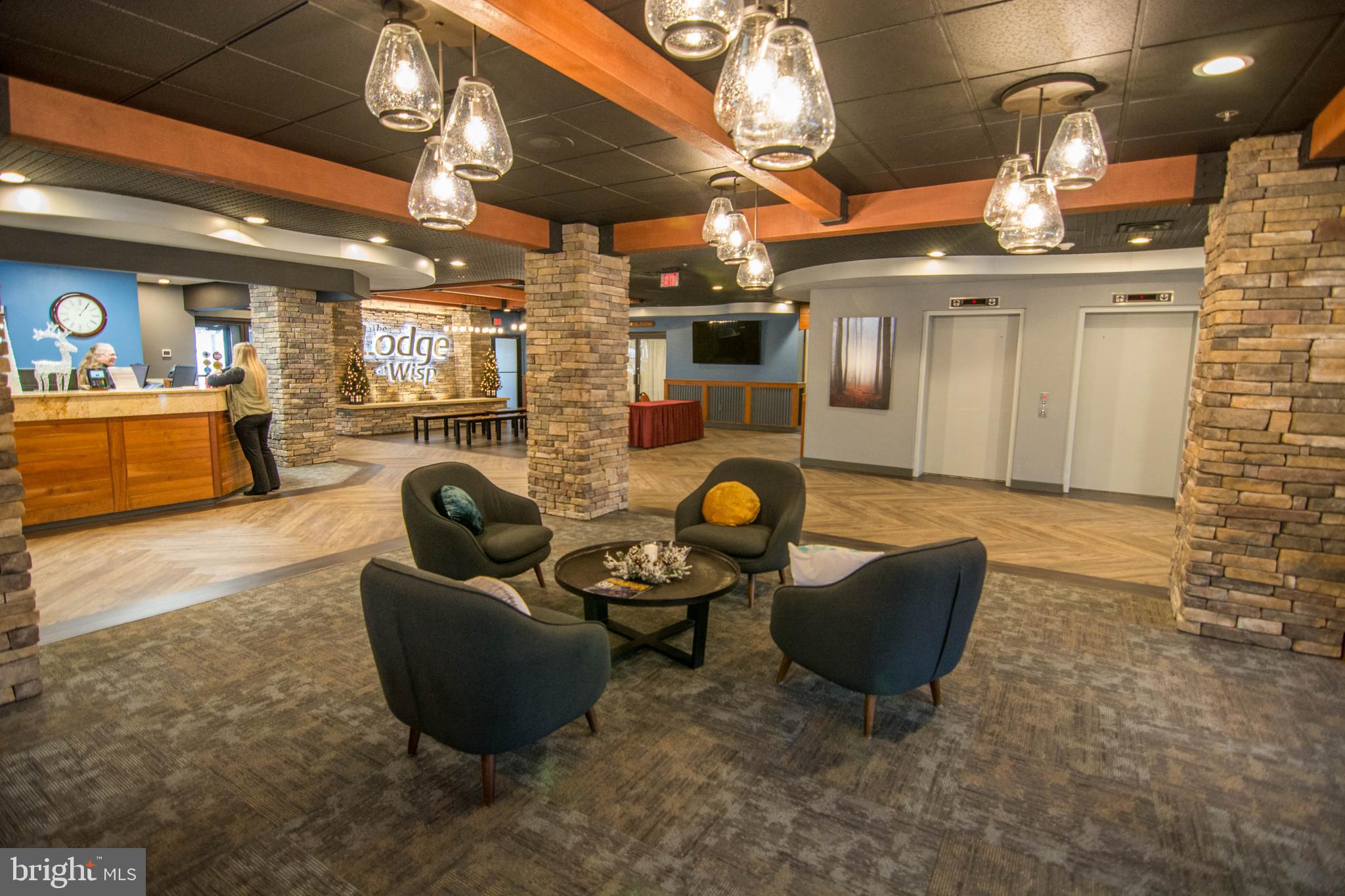 290 Marsh Hill Road, Unit 404G McHenry, MD 21541 - Photo 7 of 63 a living room with furniture and a flat screen tv