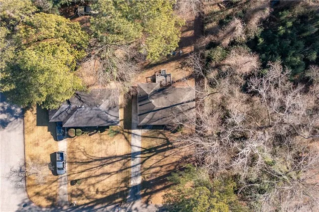 a kitchen with stainless steel appliances kitchen island granite countertop a refrigerator and a stove top oven