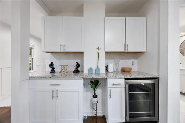 a living room with furniture ceiling fan and a window
