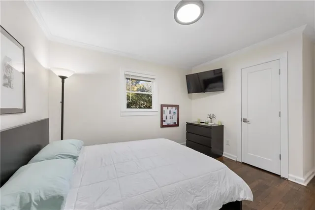 a view of backyard with wooden fence and trees