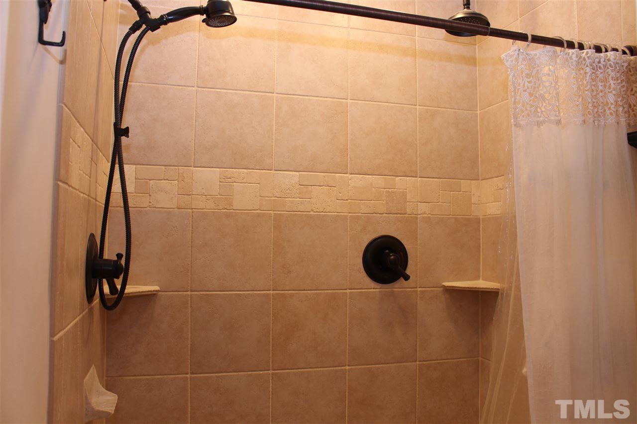 2423 Condor Court Raleigh, NC 27615 - Photo 15 of 20 a bathroom with a shower